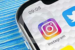 Instagram application icon on Apple iPhone X smartphone screen close-up. Instagram app icon. Social media icon. Social network