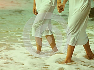 Instagram colorized vintage couple at beach legs portrait