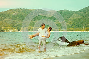 Instagram colorized vintage couple on beach portrait