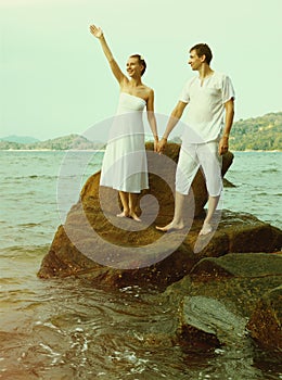 Instagram colorized vintage couple on beach portrait