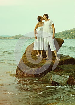 Instagram colorized vintage couple on beach portrait