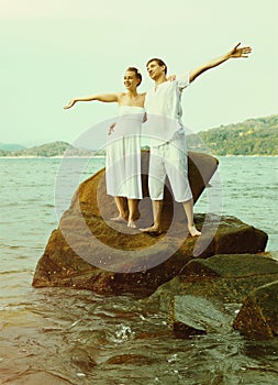 Instagram colorized vintage couple on beach portrait