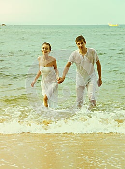 Instagram colorized vintage couple on beach portrait