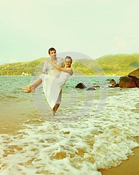 Instagram colorized vintage couple on beach portrait