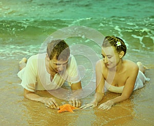 Instagram colorized vintage couple on beach portrait