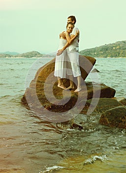 Instagram colorized vintage couple on beach portrait