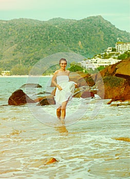 Instagram colorized vintage girl on beach portrait