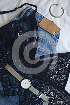 Instagram content, lifestyle flat lay: clothes and silver jewelry on white background