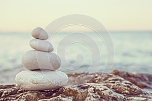 Instagram Pile of Stones on Tranquil Beach at Sunset