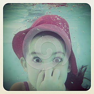 Instagram of young girl having fun under water