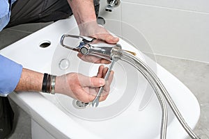 Install bidet faucet