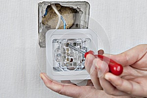 Install wall light switch, connect to electrical wiring, tighten