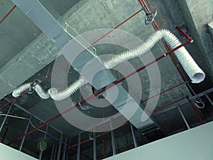 Installation of air conditioner ducting and chiller pipes system and hung it at the concrete slab.