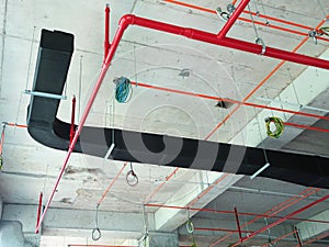 Installation of air conditioner ducting and chiller pipes system and hung it at the concrete slab.