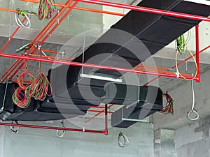 Installation of air conditioner ducting and chiller pipes system and hung it at the concrete slab.