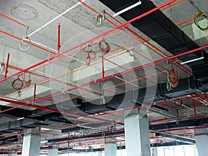 Installation of air conditioner ducting and chiller pipes system and hung it at the concrete slab.