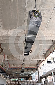 Installation of air conditioner ducting and chiller pipes system and hung it at the concrete slab.