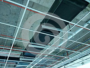 Installation of air conditioner ducting and chiller pipes system and hung it at the concrete slab.