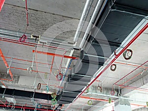 Installation of air conditioner ducting and chiller pipes system and hung it at the concrete slab.