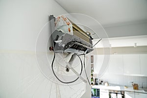 Installation air conditioning system in room with white wall in apartment, closeup