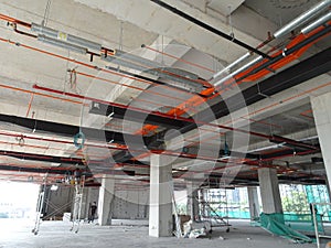 Installation of airconditioner ducting and chiller pipes system and hung it at the concrete slab.