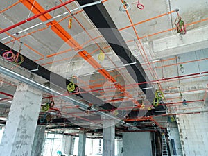 Installation of airconditioner ducting and chiller pipes system and hung it at the concrete slab.