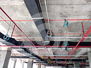Installation of airconditioner ducting and chiller pipes system and hung it at the concrete slab.