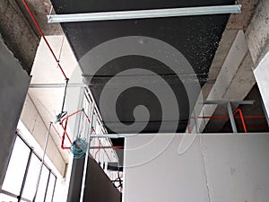 Installation of airconditioner ducting and chiller pipes system and hung it at the concrete slab.