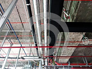 Installation of airconditioner ducting and chiller pipes system and hung it at the concrete slab.