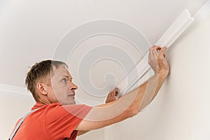 Installation of ceiling moldings.