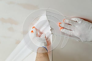 Installation of ceiling moldings.