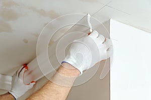 Installation of ceiling moldings.