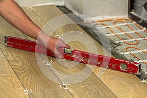 Installation of ceramic tiles and heating elements in warm tile