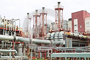 Installation of cogeneration of electricity and production of superheated steam with equipment and high pipes at an oil refining photo