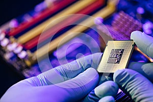 Installation of computer processor in the socket. Microprocessor with clearly visible silicon core and cache chip