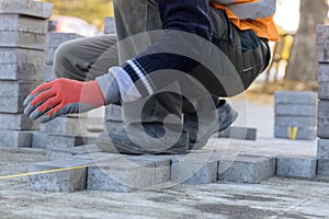 Installation of concrete bricks during sidewalk construction