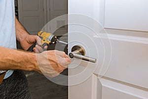 Installation locked interior door woodworker hands install lock photo