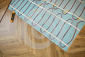 Installation of electric underfloor heating system indoors, above view