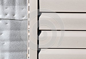 Installation on facade panels beige vinyl siding