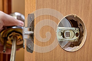 Installation of a handle with a latch lock for an interior door