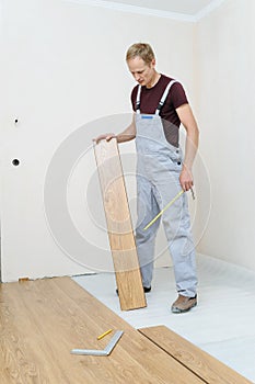 Installation of a laminate floorboard.