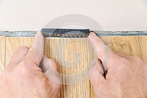 Installation of a laminate floorboard.