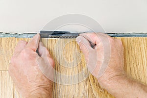 Installation of a laminate floorboard.