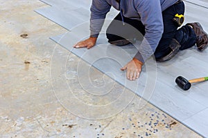 Installation of laminate flooring in a new home by man