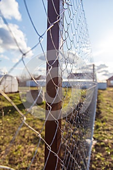 Installation of a metal mesh on the fence