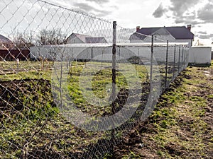 Installation of a metal mesh on the fence