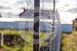 Installation of a metal mesh on the fence