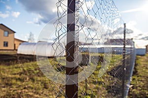 Installation of a metal mesh on the fence