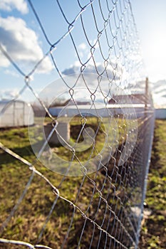 Installation of a metal mesh on the fence