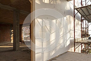 Installation of outer coat insulating on a residential home